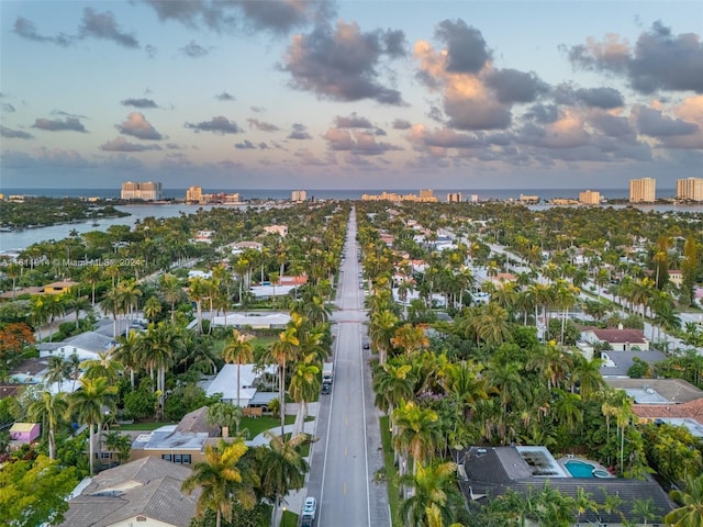 aerial view at dusk with a water view