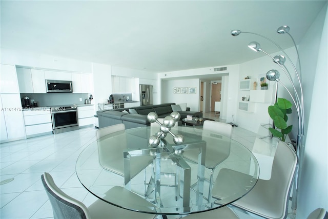 dining room featuring light tile patterned flooring