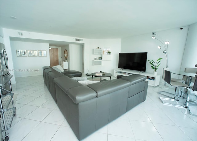 living room featuring light tile patterned floors