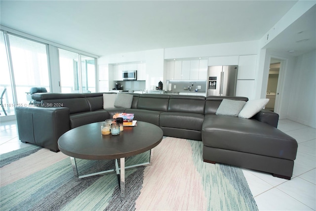 tiled living room with expansive windows