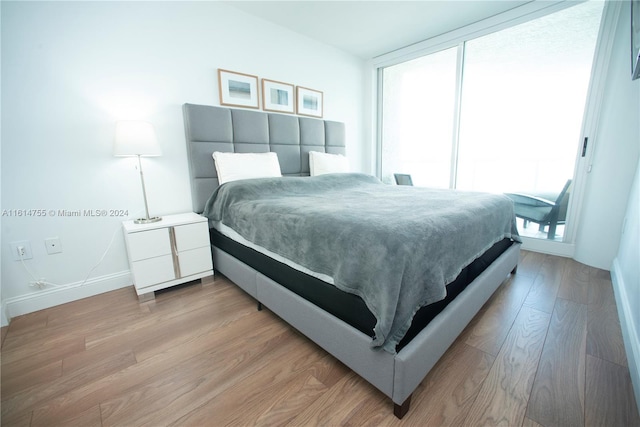 bedroom with light wood-type flooring