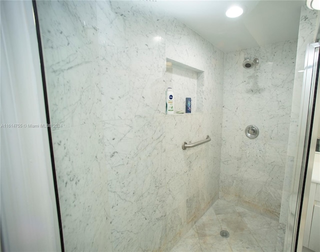 bathroom featuring vanity and a tile shower