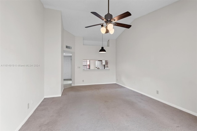 unfurnished room featuring carpet floors, high vaulted ceiling, and ceiling fan