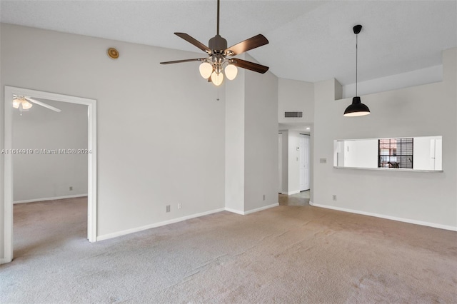 unfurnished living room featuring carpet floors, high vaulted ceiling, and ceiling fan