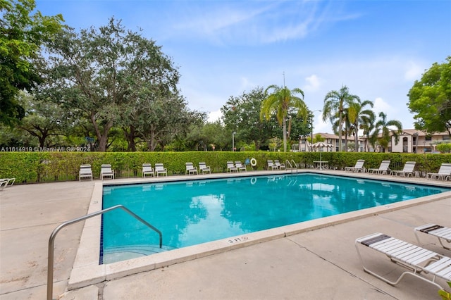 view of swimming pool with a patio