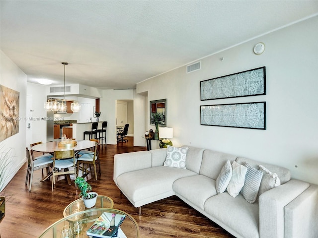 living room with dark hardwood / wood-style flooring