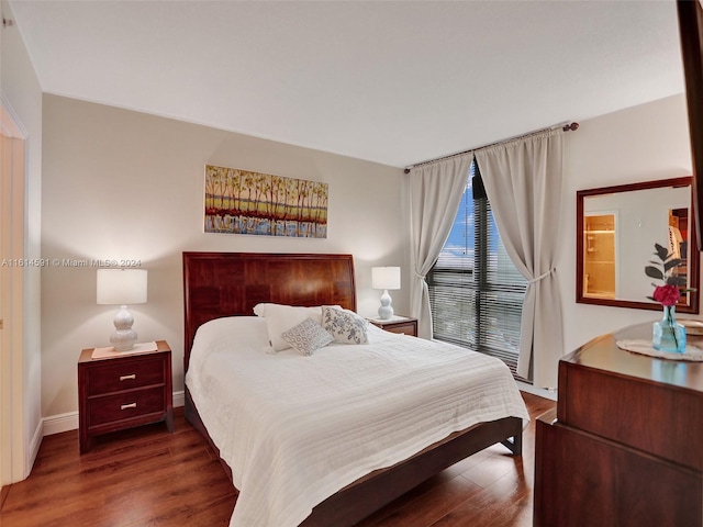 bedroom featuring dark hardwood / wood-style floors