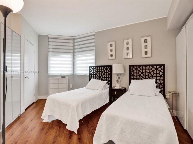 bedroom with wood-type flooring