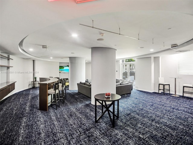 dining room featuring dark colored carpet