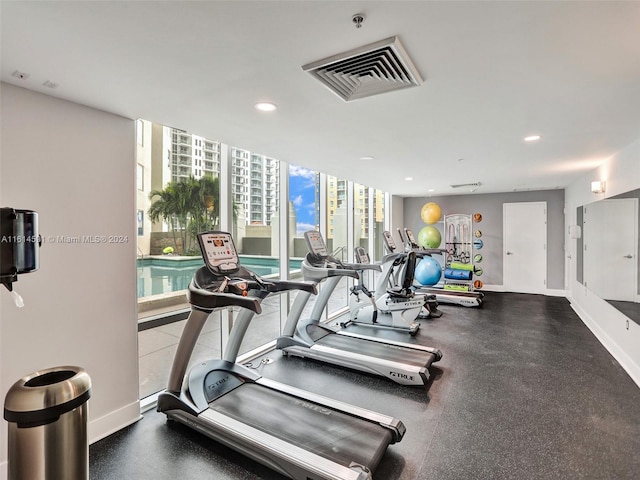 workout area with floor to ceiling windows