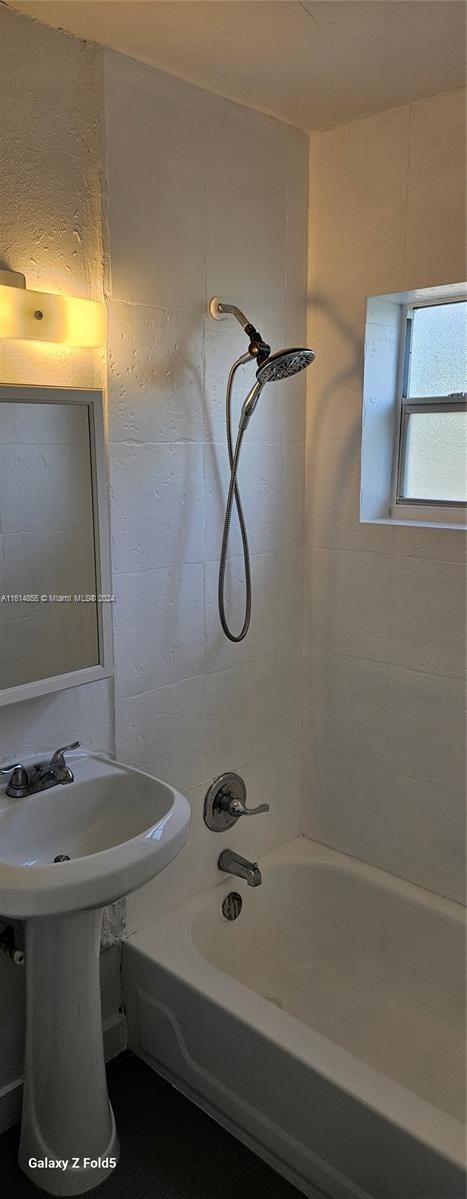 bathroom with shower / washtub combination