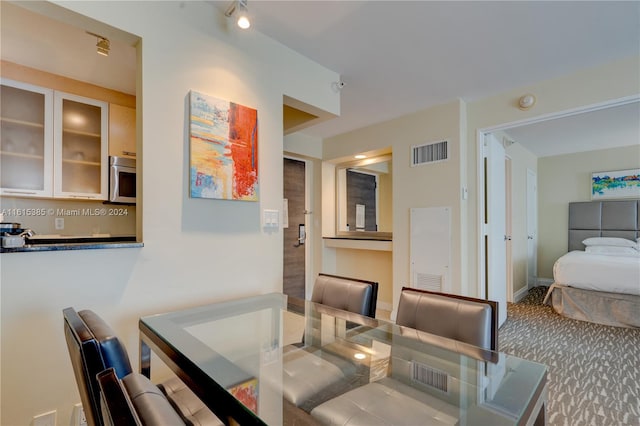 dining space with carpet floors