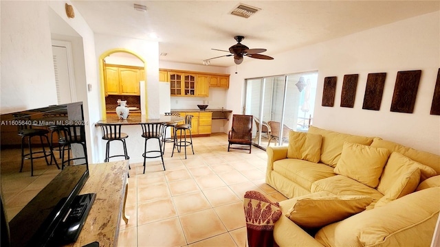 living room with ceiling fan and light tile floors