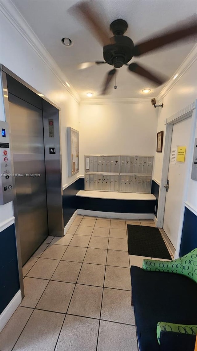 kitchen featuring elevator, ceiling fan, light tile floors, and crown molding