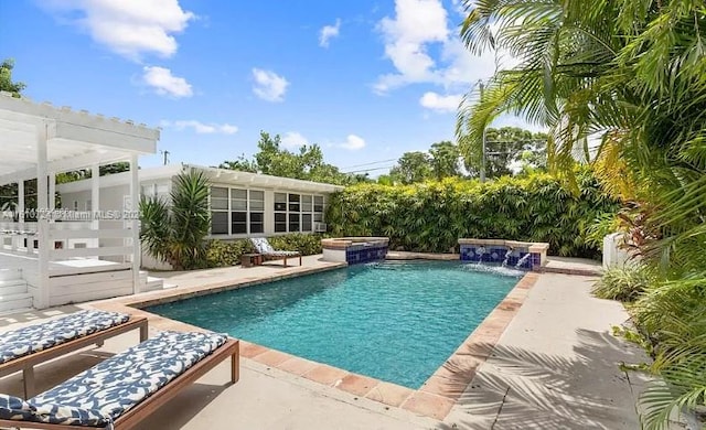 view of pool with pool water feature, a patio area, an in ground hot tub, and a pergola