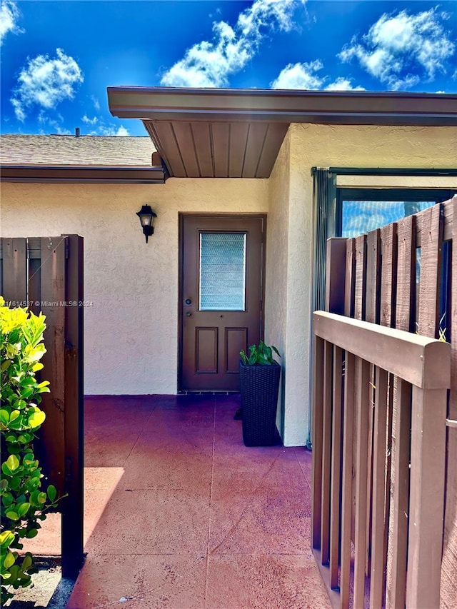 doorway to property featuring a patio