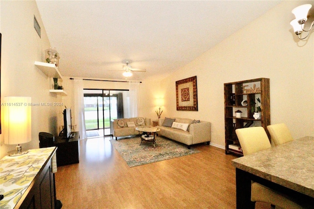 living room with hardwood / wood-style flooring and ceiling fan