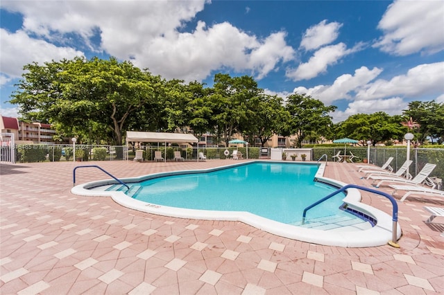 view of swimming pool with a patio area