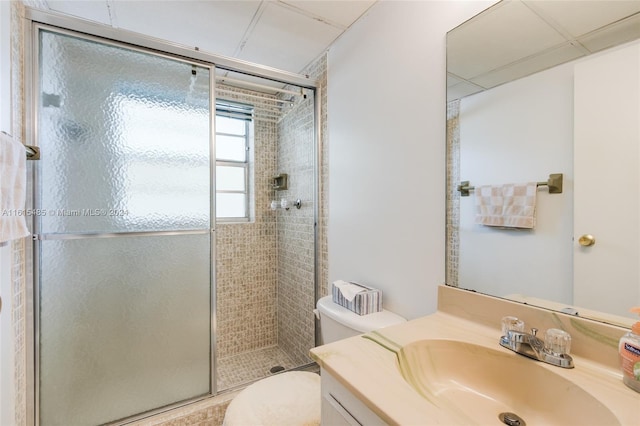 bathroom featuring walk in shower, oversized vanity, and toilet