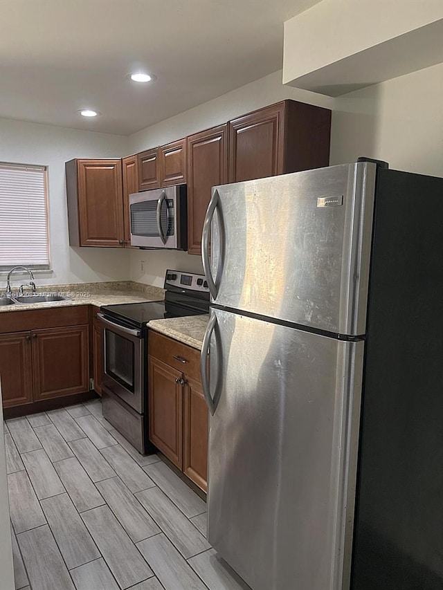 kitchen with appliances with stainless steel finishes and sink