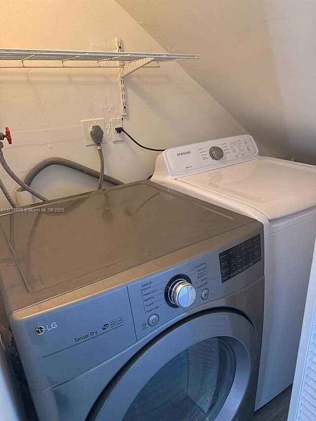 laundry area with separate washer and dryer