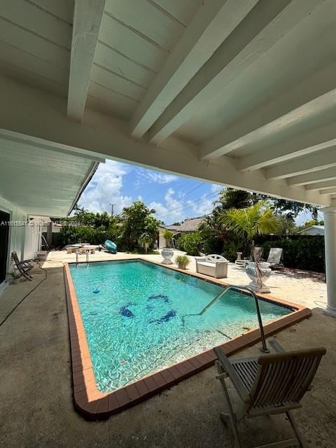 view of pool featuring a patio