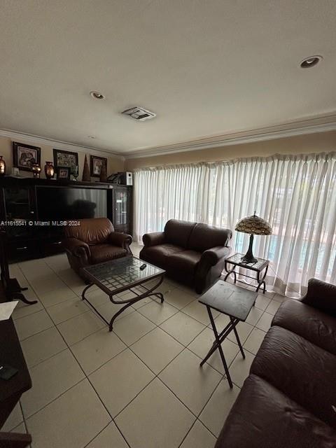 tiled living room with crown molding