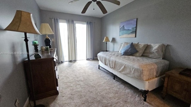 bedroom with ceiling fan and light carpet