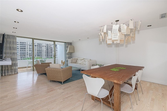 dining room featuring recessed lighting, light wood-type flooring, visible vents, and baseboards