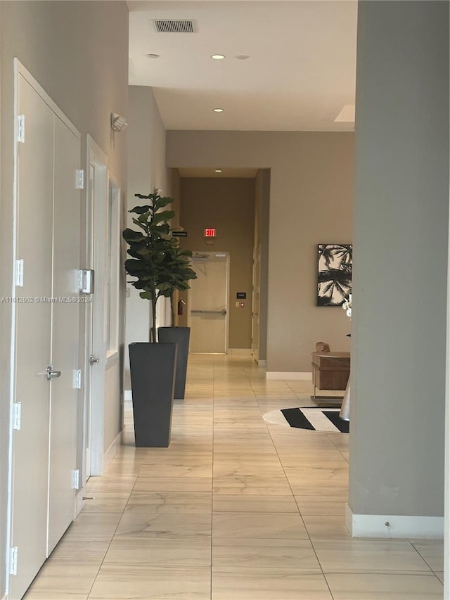 hallway featuring recessed lighting, baseboards, and visible vents