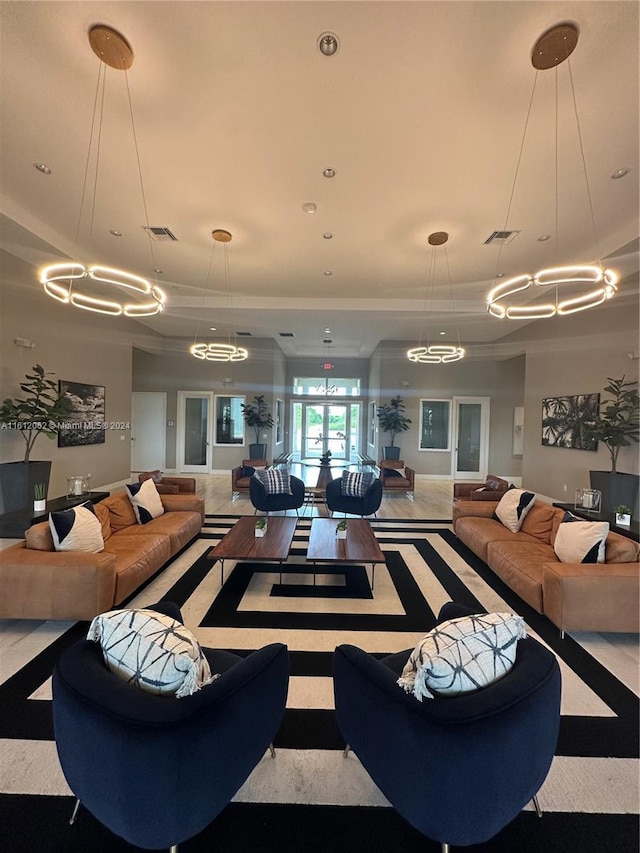 living area with visible vents and recessed lighting