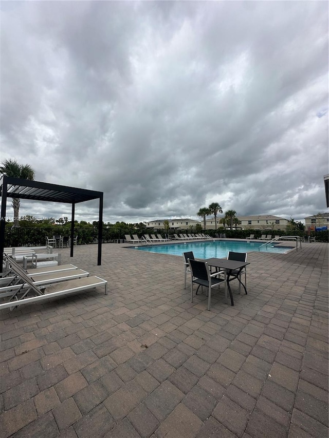 pool with a patio area