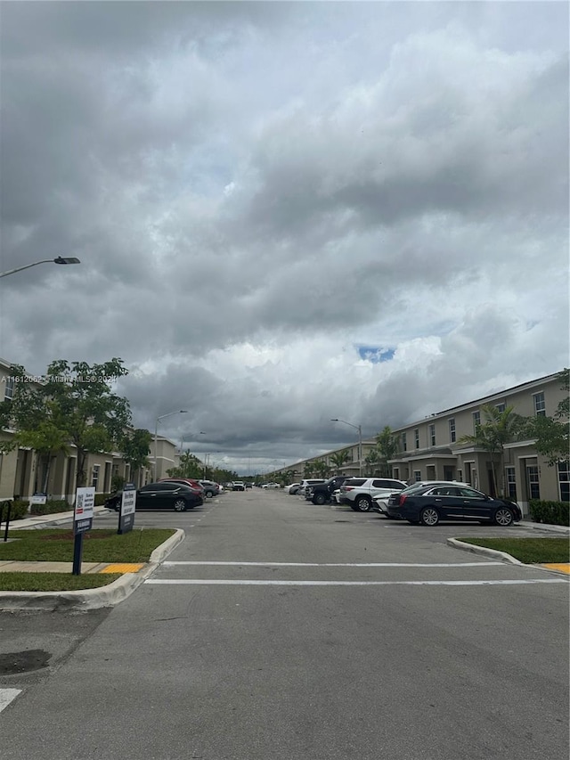 view of street with curbs and street lights