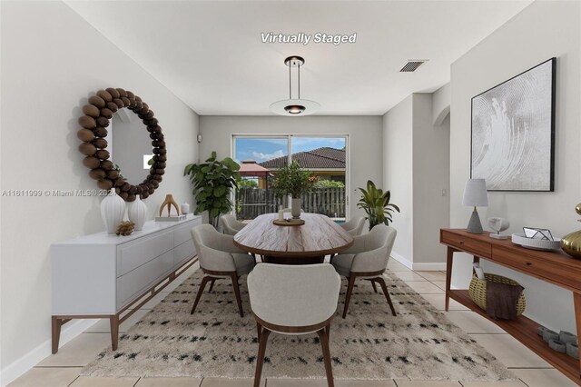 dining space with light tile patterned flooring