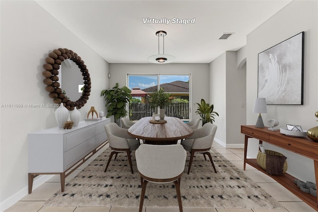 dining area with light tile patterned floors