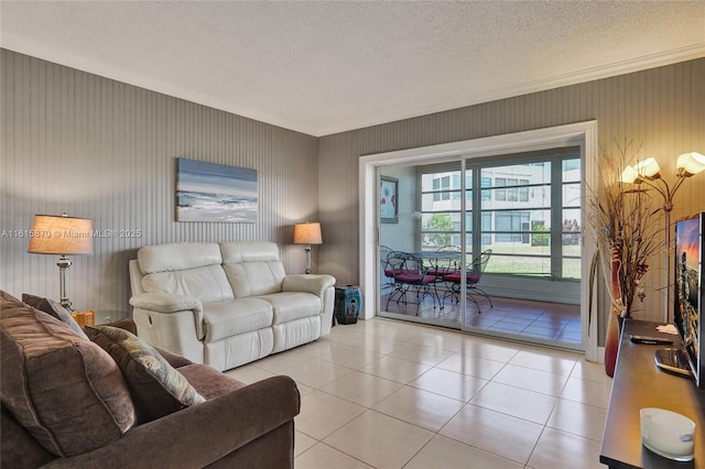 tiled living room featuring a textured ceiling