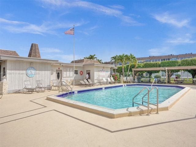 view of swimming pool featuring a patio area