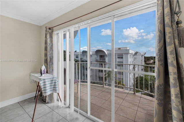 doorway to outside featuring crown molding and light tile patterned flooring