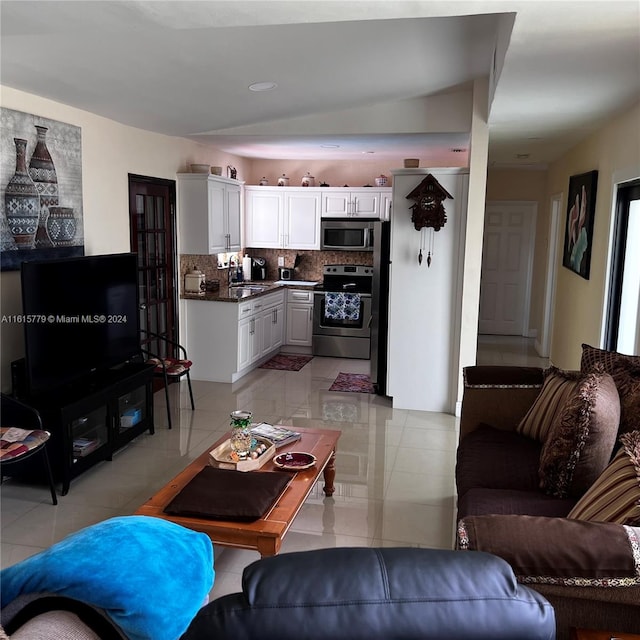 living room with sink and light tile patterned floors