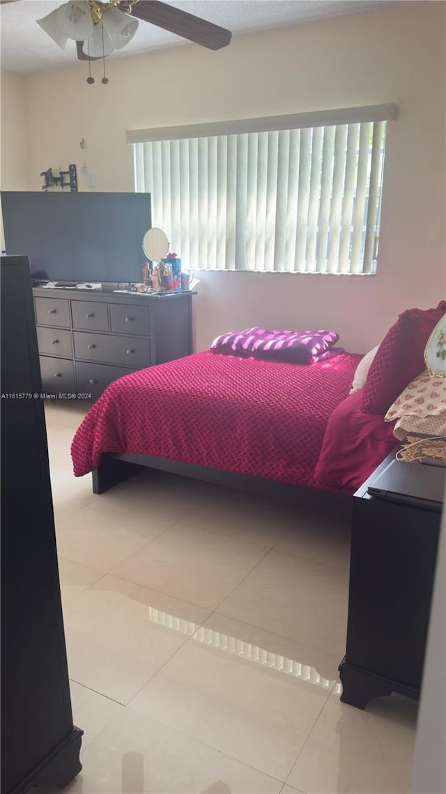 8441 SW 32nd Ter, Miami, FL 33155 - bedroom featuring light tile patterned flooring and a ceiling fan