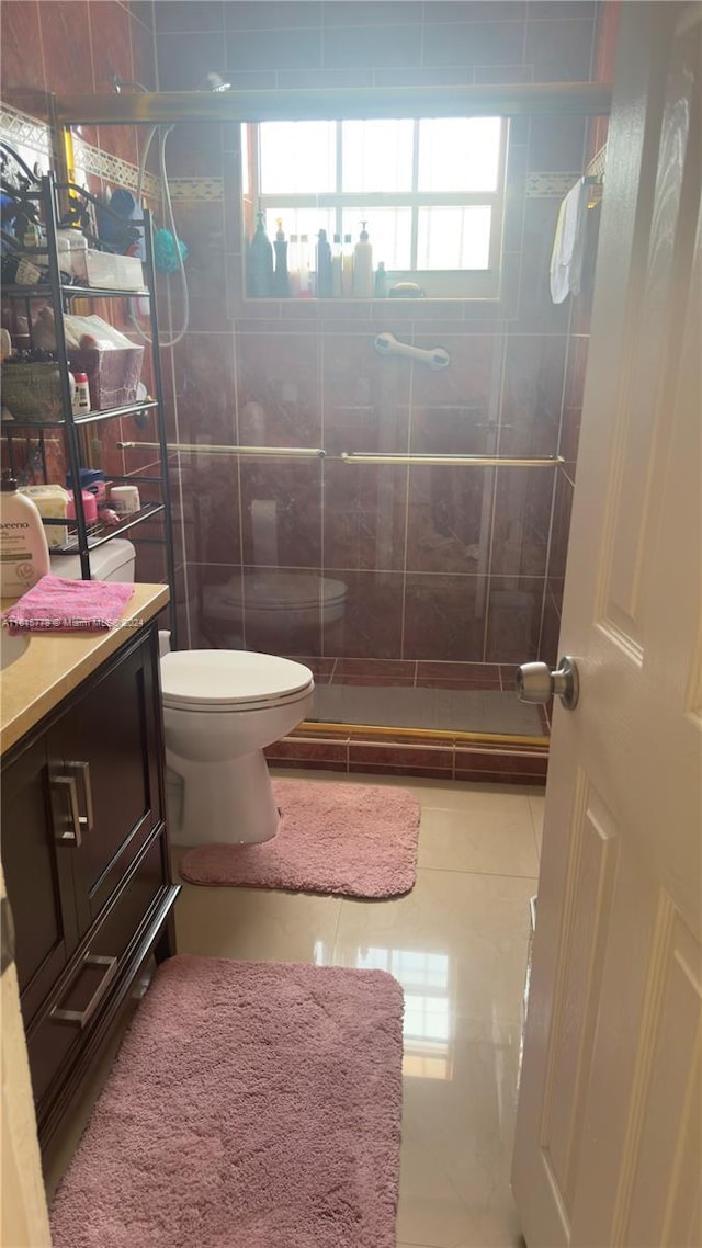 8441 SW 32nd Ter, Miami, FL 33155 - bathroom featuring a tile shower, vanity, and tile patterned flooring