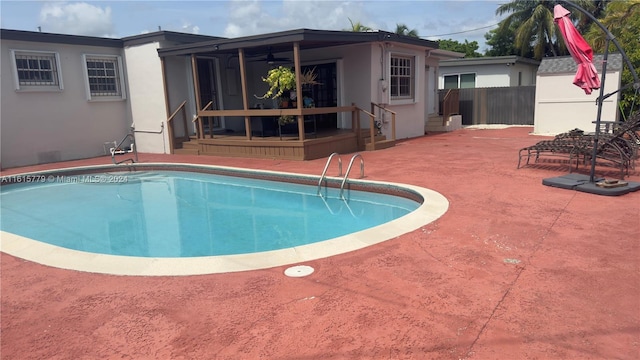 8441 SW 32nd Ter, Miami, FL 33155 - swimming pool featuring a patio area, ceiling fan, and a sunroom