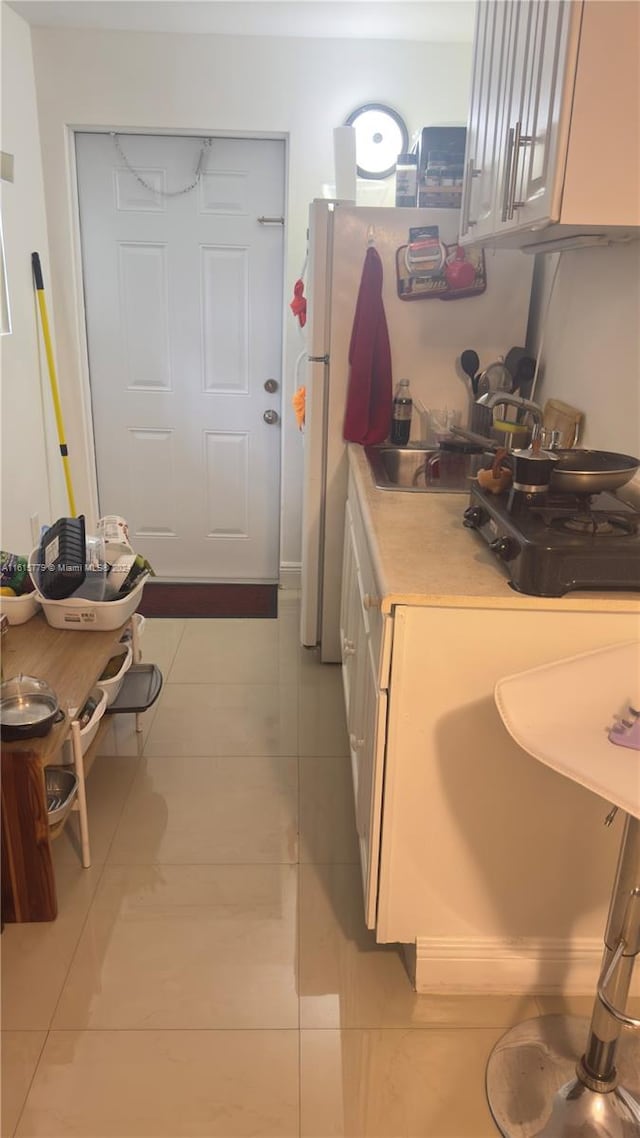 kitchen featuring light tile patterned flooring