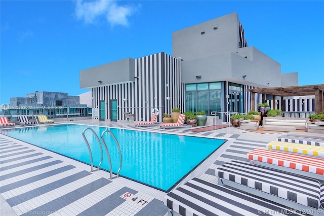 view of swimming pool featuring a patio