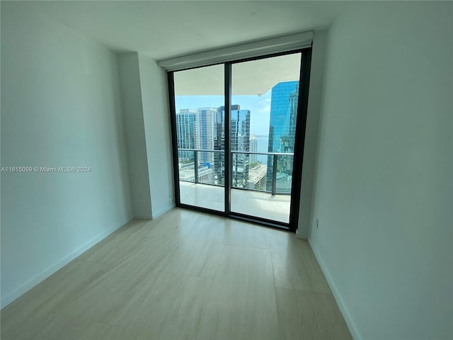 spare room featuring expansive windows