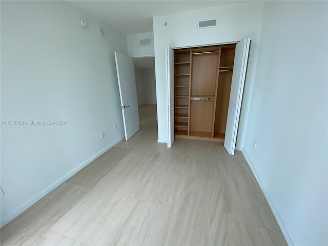 unfurnished bedroom featuring a closet