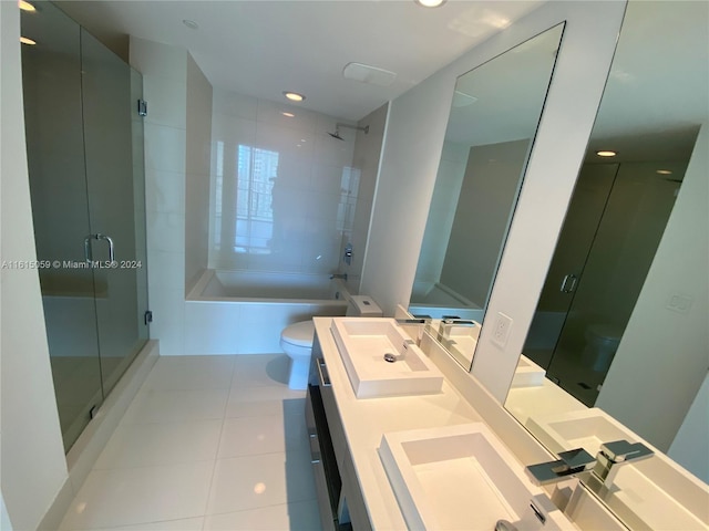 full bathroom featuring tile patterned floors, toilet, vanity, and shower with separate bathtub