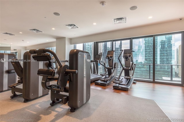 workout area with wood-type flooring