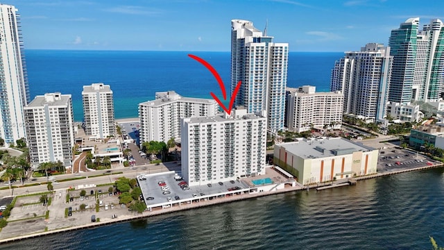 birds eye view of property with a water view