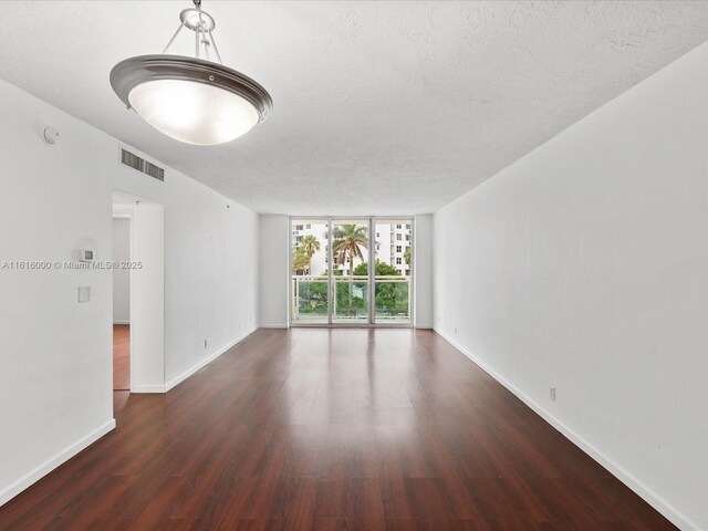 3000 S Ocean Dr Unit 206, Hollywood, FL 33019 - spare room with wood finished floors, a textured ceiling, and a smoke detector